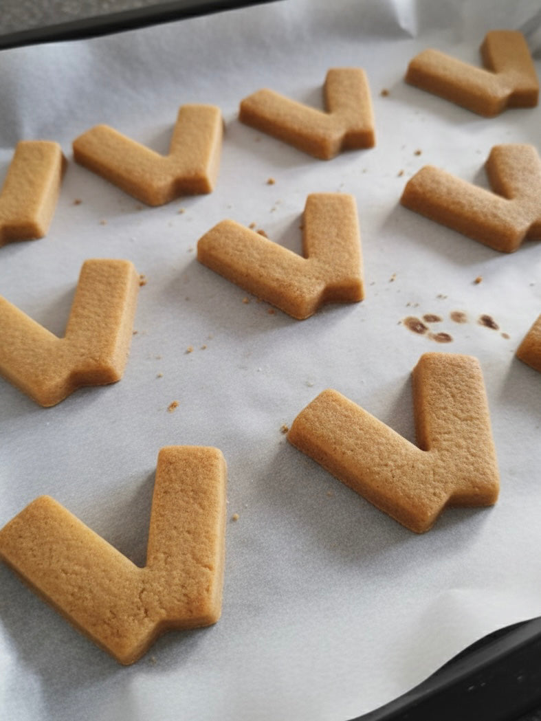 Koekjes in de vorm van het Venlosche beeldmerk